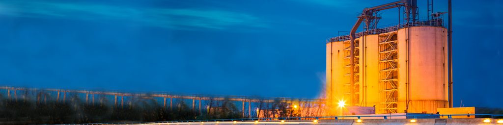 Lit up silos in distance